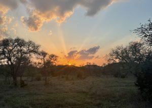 Hunt the Texas Hill Country property with its rolling, brush-covered hills, large stretches of land, and a gorgeous sunsets lighting up the sky.